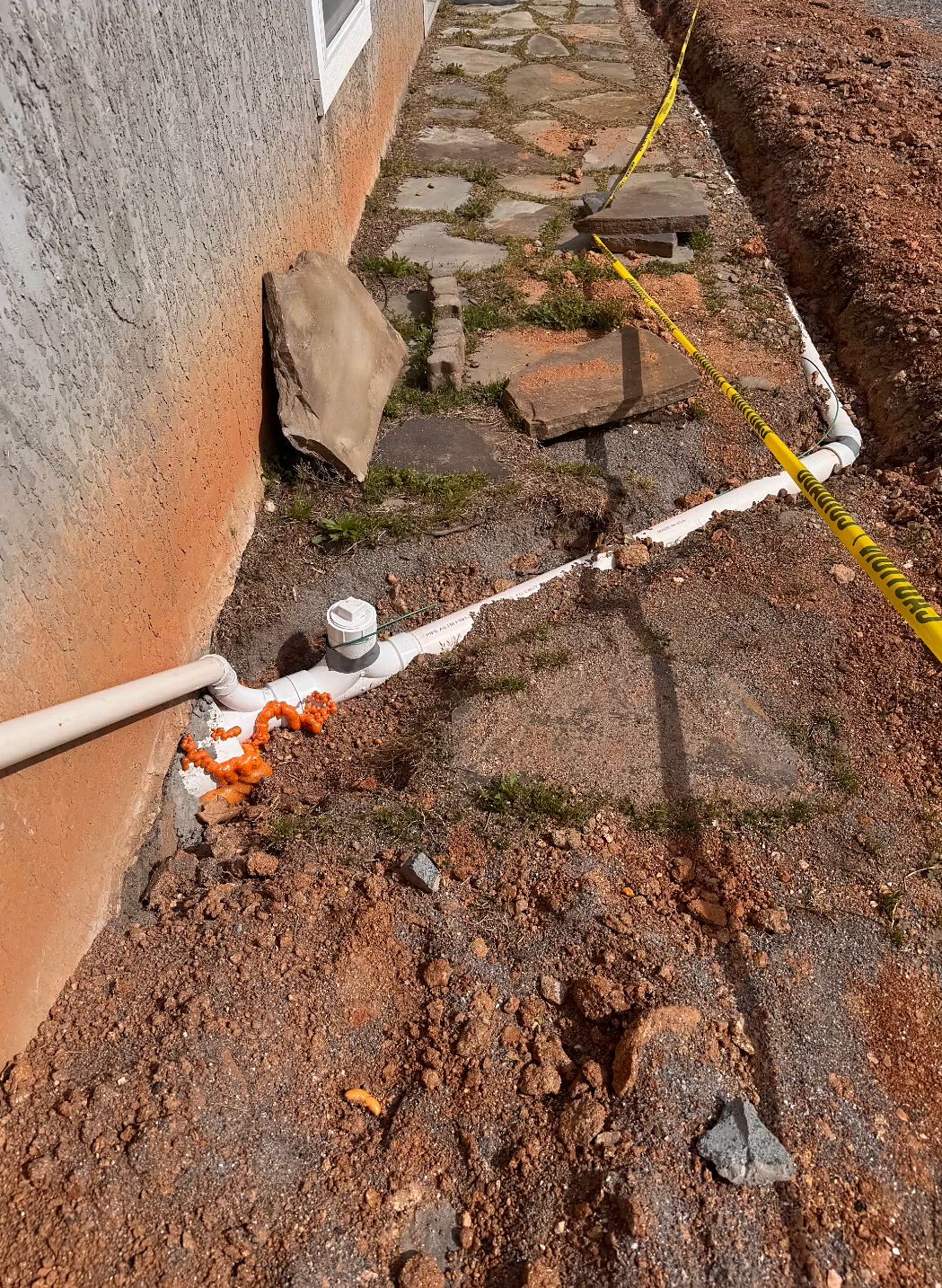 Drain cleanout in trench